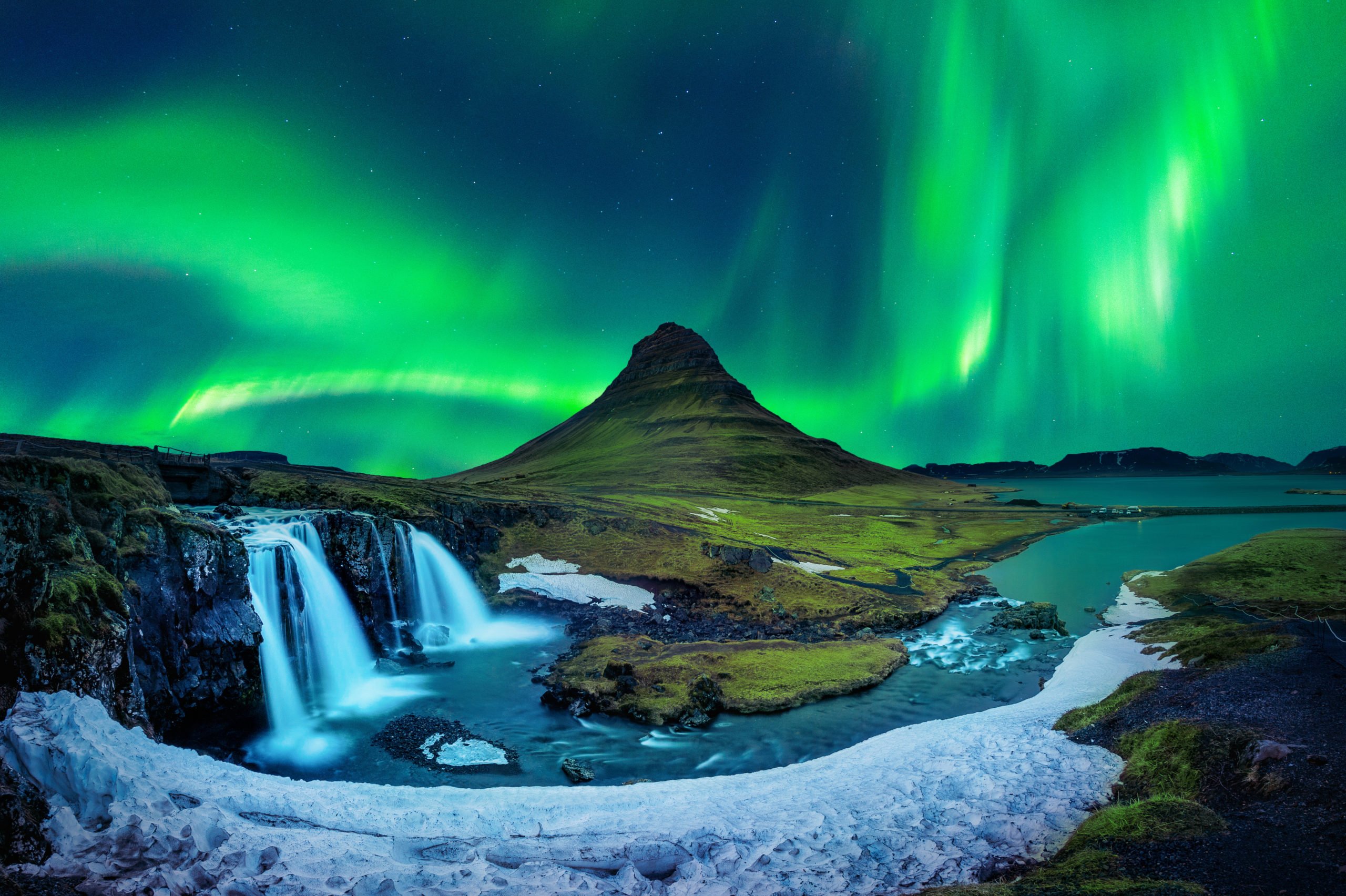 Aurora Borealis lighting up the sky over an Icelandic lagoon